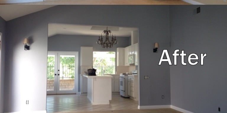 Completed interior repaint showing grey walls, white trims and the adjoining kitchen