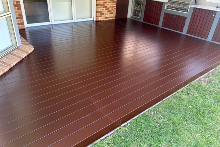 Completed timber deck coating beside an outdoor entertaining area